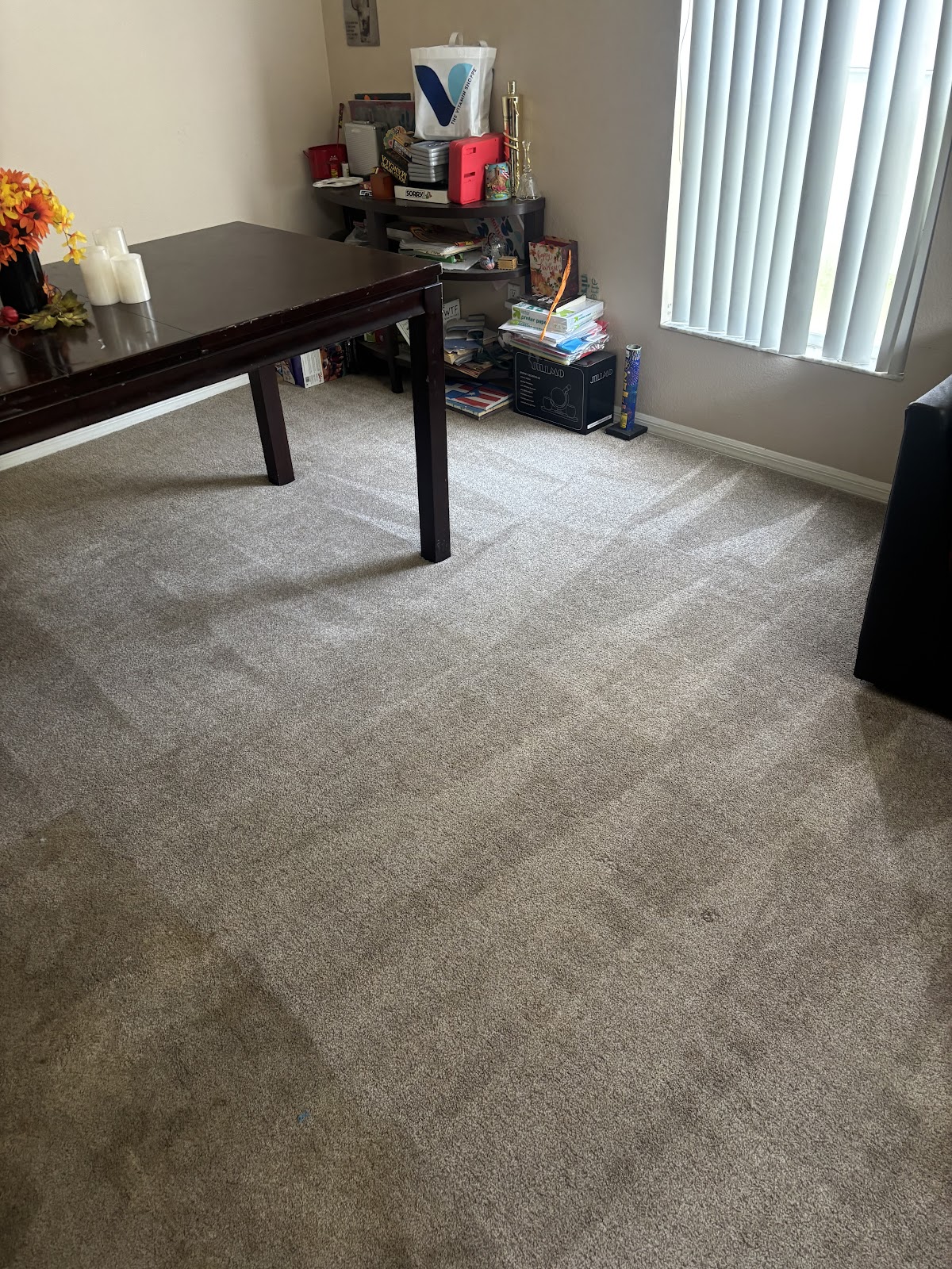 Fresh carpet cleaning passes in a dining room